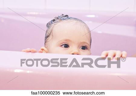 Baby peeking over side of bathtub View Large Photo Image Stock Photography - Baby peeking over side of bathtub. Fotosearch