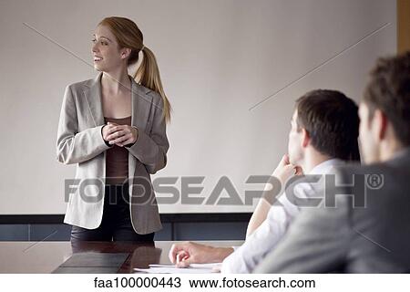 Businesswoman facilitating group discussion View Large Photo Image Stock Image - Businesswoman facilitating group discussion. Fotosearch