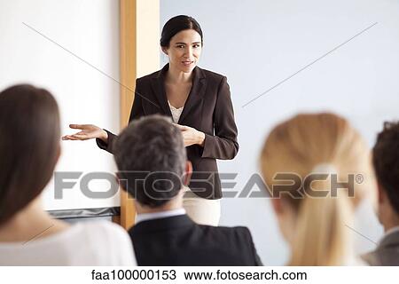 Businesswoman giving presentation at meeting View Large Photo Image Stock Image - Businesswoman giving presentation at meeting. Fotosearch