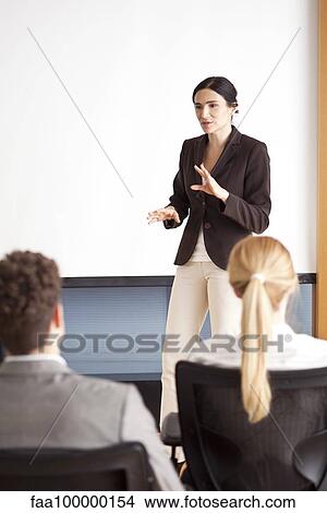 Businesswoman giving presentation View Large Photo Image Picture - Businesswoman giving presentation. Fotosearch