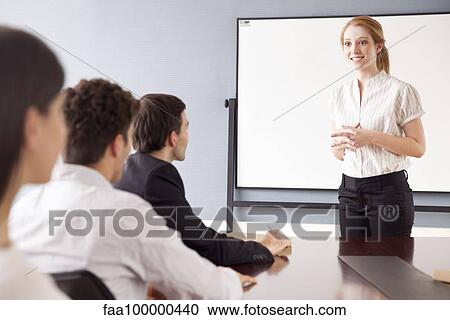 Businesswoman leading business meeting View Large Photo Image Stock Image - Businesswoman leading business meeting. Fotosearch