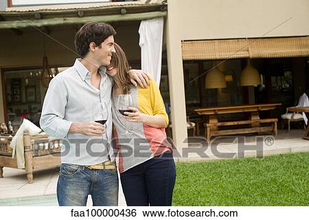 Couple celebrating at resort View Large Photo Image Stock Photograph - Couple celebrating at resort. Fotosearch