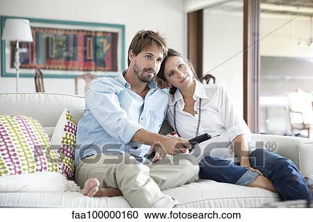 Couple watching TV together View Large Photo Image Stock Image - Couple watching TV together. Fotosearch