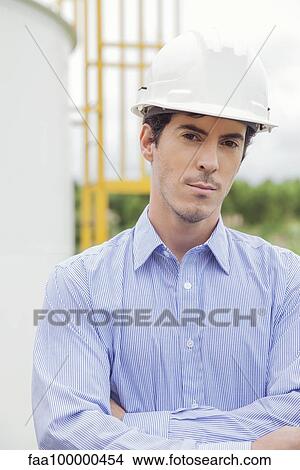 Engineer at oil refinery, portrait View Large Photo Image Picture - Engineer at oil refinery, portrait. Fotosearch
