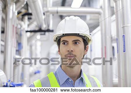 Engineer in industrial plan, portrait View Large Photo Image Stock Image - Engineer in industrial plan, portrait. Fotosearch