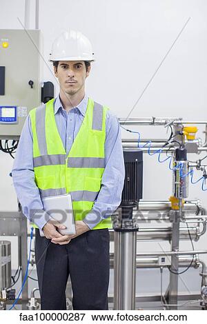 Engineer in industrial plant, portrait View Large Photo Image Stock Photo - Engineer in industrial plant, portrait. Fotosearch