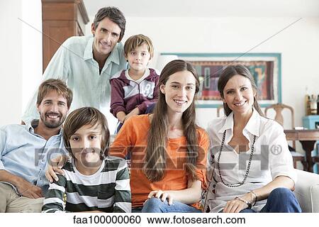 Family together in living room, portrait View Large Photo Image Stock Image - Family together in living room, portrait. Fotosearch