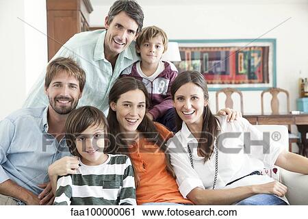 Family together in living room, portrait View Large Photo Image Stock Image - Family together in living room, portrait. Fotosearch
