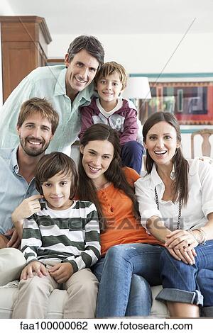 Family together in living room, portrait View Large Photo Image Stock Image - Family together in living room, portrait. Fotosearch