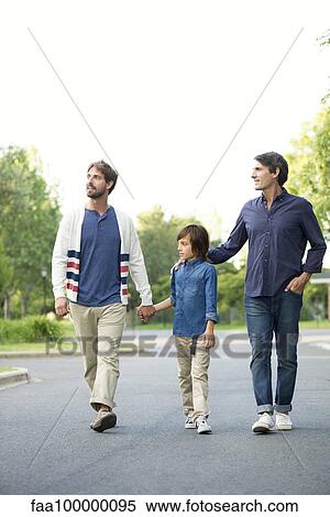 Fathers and son walking together outdoors View Large Photo Image Stock Photography - Fathers and son walking together outdoors. Fotosearch
