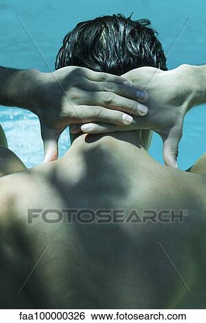 Man clasping hands behind head, rear view View Large Photo Image Stock Photograph - Man clasping hands behind head, rear view. Fotosearch