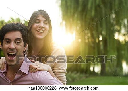 Man giving girlfriend piggyback ride View Large Photo Image Stock Photo - Man giving girlfriend piggyback ride. Fotosearch