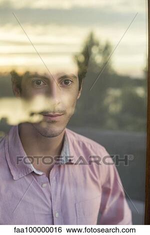 Man looking introspectively at view View Large Photo Image Stock Photograph - Man looking introspectively at view. Fotosearch