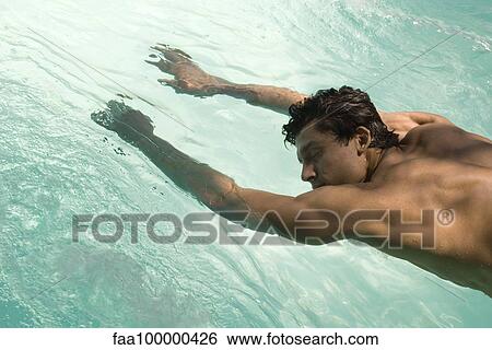Man reaching arms out into water View Large Photo Image Stock Photograph - Man reaching arms out into water. Fotosearch