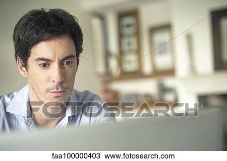 Man staring at laptop computer View Large Photo Image Stock Image - Man staring at laptop computer. Fotosearch