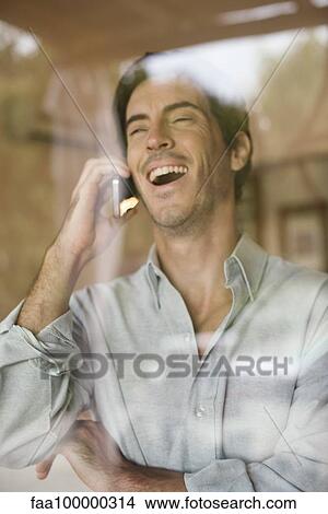 Man using cell phone bursting out laughing View Large Photo Image Picture - Man using cell phone bursting out laughing. Fotosearch