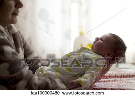 Mother holding baby View Large Photo Image Stock Image - Mother holding baby. Fotosearch