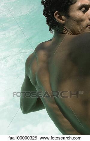 Muscular man leaning over pool, rear view View Large Photo Image Stock Photography - Muscular man leaning over pool, rear view. Fotosearch