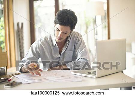 Officer worker working at desk View Large Photo Image Stock Photography - Officer worker working at desk. Fotosearch
