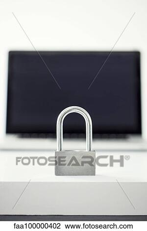Padlock in front of laptop computer representing internet security View Large Photo Image Stock Image - Padlock in front of laptop computer representing internet security. Fotosearch
