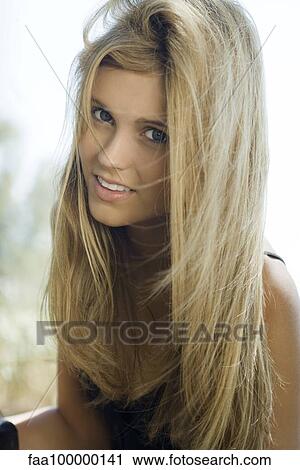 Teen Girl With Tousled Hair Smiling At Camera Portrait Stock