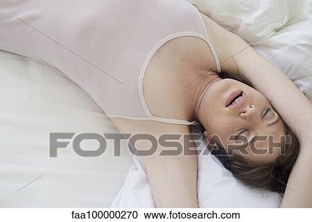 Woman alseep in bed View Large Photo Image Stock Image - Woman alseep in bed. Fotosearch