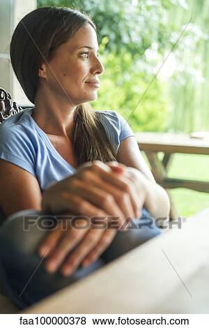 Woman enjoying comtemplative moment alone View Large Photo Image Stock Photo - Woman enjoying comtemplative moment alone. Fotosearch