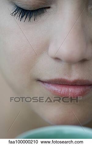 Woman smelling hot drink, close-up View Large Photo Image Stock Image - Woman smelling hot drink, close-up. Fotosearch