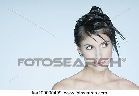 Woman with spiky hairstyle, looking away, portrait View Large Photo Image Stock Photo - Woman with spiky hairstyle, looking away, portrait. Fotosearch