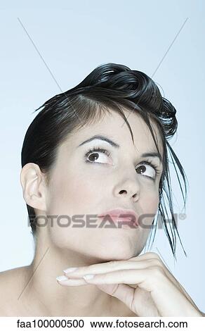 Woman with spiky hairstyle, looking up, portrait View Large Photo Image Stock Image - Woman with spiky hairstyle, looking up, portrait. Fotosearch