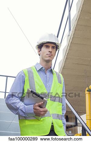 Worker at industrial site View Large Photo Image Stock Photo - Worker at industrial site. Fotosearch
