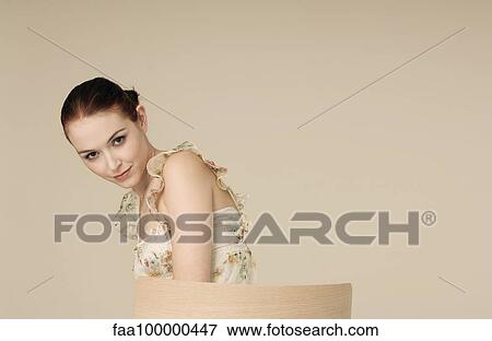 Young woman looking seductively at camera, portrait View Large Photo Image Stock Photo - Young woman looking seductively at camera, portrait. Fotosearch