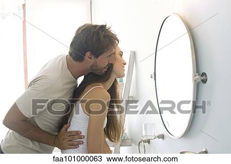 Affectionate couple getting ready for the day View Large Photo Image Stock Image - Affectionate couple getting ready for the day. Fotosearch
