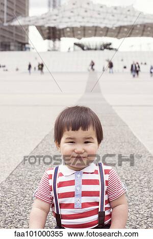 "Baby boy in city square, portrait" View Large Photo Image Stock Photography - "Baby boy in city square, portrait". Fotosearch