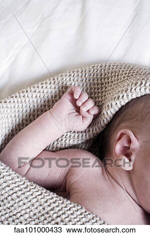 Stock Image - "Baby napping, cropped". Fotosearch
