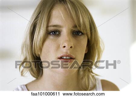 "Blonde teenage girl looking at camera, portrait" View Large Photo Image Stock Image - "Blonde teenage girl looking at camera, portrait". Fotosearch