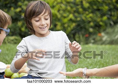 Boy playing hand slap game View Large Photo Image Stock Image - Boy playing hand slap game. Fotosearch