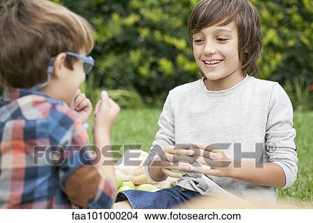 Boys playing hand game View Large Photo Image Picture - Boys playing hand game. Fotosearch