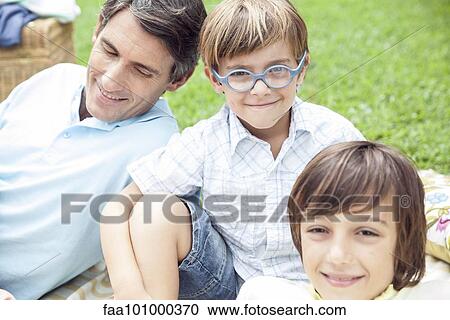 Boys spending time with father outdoors View Large Photo Image Stock Image - Boys spending time with father outdoors. Fotosearch