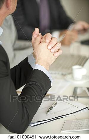 Stock Image - Businessman at meeting. Fotosearch