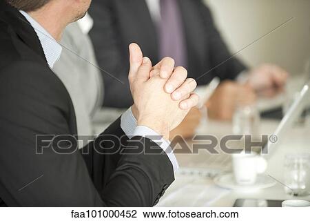 Stock Image - Businessman at meeting. Fotosearch