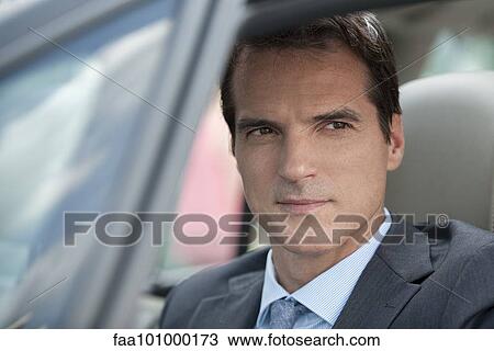 Businessman driving car View Large Photo Image Stock Image - Businessman driving car. Fotosearch