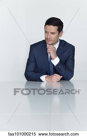 "Businessman looking away in thought, portrait" View Large Photo Image Stock Photography - "Businessman looking away in thought, portrait". Fotosearch