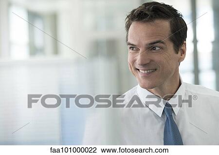 "Businessman looking away, smiling, portrait" View Large Photo Image Stock Image - "Businessman looking away, smiling, portrait". Fotosearch