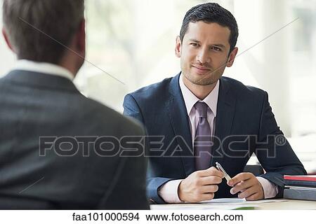 Businessman meeting with client View Large Photo Image Picture - Businessman meeting with client. Fotosearch