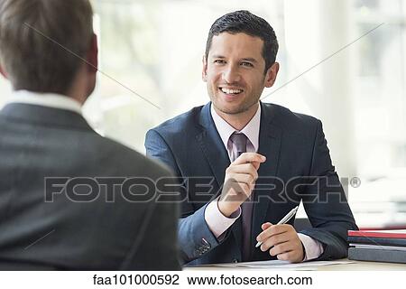 Businessman meeting with client View Large Photo Image Stock Image - Businessman meeting with client. Fotosearch
