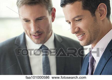 Businessman meeting with colleague View Large Photo Image Stock Photograph - Businessman meeting with colleague. Fotosearch