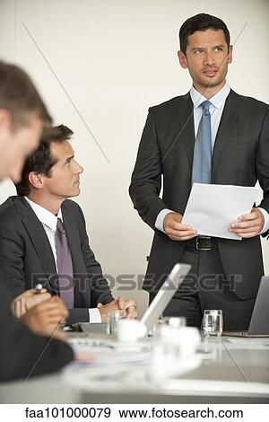 Businessman offering motivational speach at meeting View Large Photo Image Stock Photo - Businessman offering motivational speach at meeting. Fotosearch