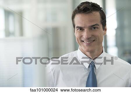 "Businessman smiling cheerfully, portrait" View Large Photo Image Picture - "Businessman smiling cheerfully, portrait". Fotosearch