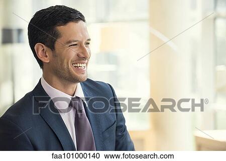 Businessman smiling cheerfully View Large Photo Image Stock Image - Businessman smiling cheerfully. Fotosearch